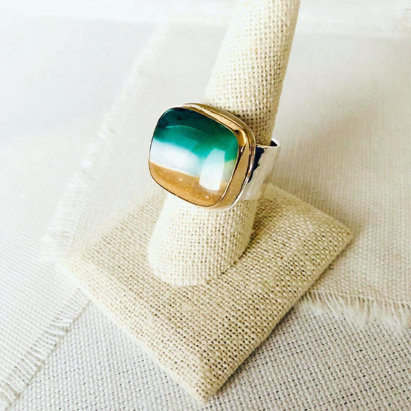 This incredible ring is made from blue opalized fossilized Indonesian wood and reminds me of the beaches of Mauil