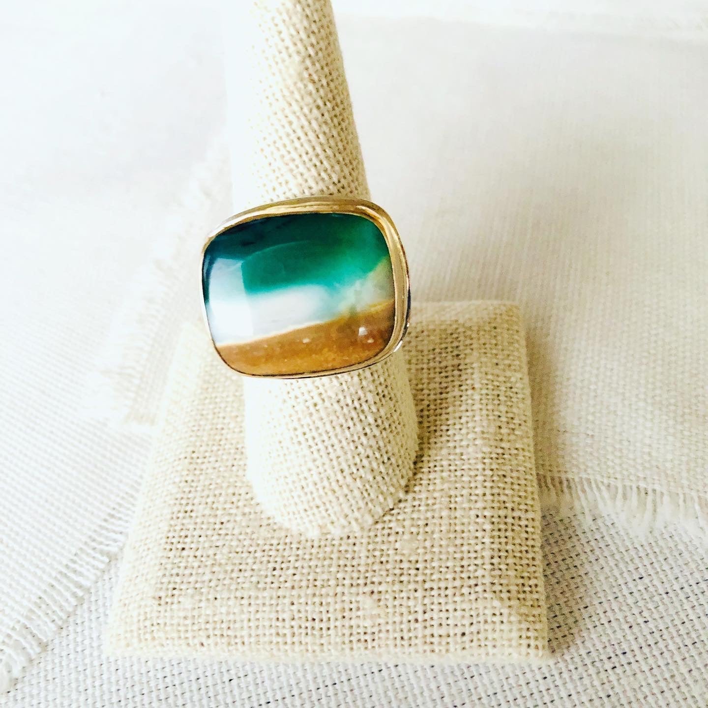 This incredible ring is made from blue opalized fossilized Indonesian wood and reminds me of the beaches of Mauil