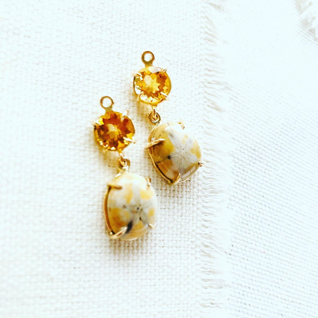 Sea urchin earrings paired with citrine and set in 14kt gold.  These fossilized sea urchin earrings make a beautiful long lasting souvenir from Hawaii.