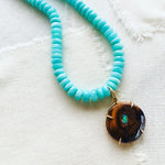 This gorgeous gold necklace is made from Yowah Nut and comes from Australian.  The Yowah Nut pendant is strung on a beautiful strand of turquoise colored Amazonite beads and finished with a 14kt gold clasp.