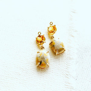 Sea urchin earrings paired with citrine and set in 14kt gold. These fossilized sea urchin earrings make a beautiful long lasting souvenir from Hawaii.