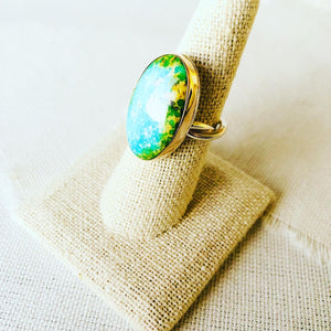 This ring is made with Sonoran Gold Turquoise and set in 14kt gold bezel with a handmade twisted shank. This turquoise statement ring reminds me so much of an ocean lagoon with surrounding rainforest like we have in Hawaii.