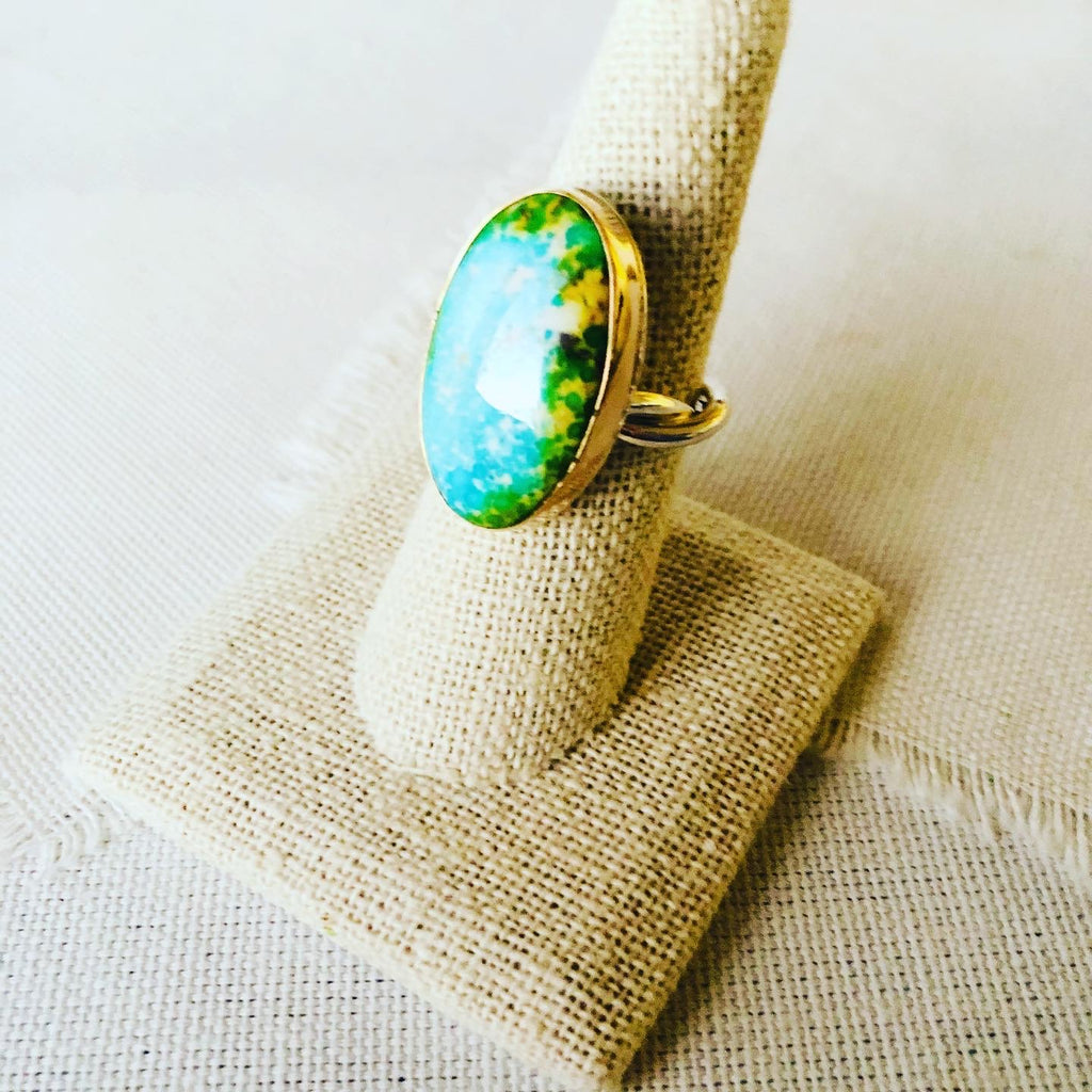 This ring is made with Sonoran Gold Turquoise and set in 14kt gold bezel with a handmade twisted shank.  This turquoise statement ring reminds me so much of an ocean lagoon with surrounding rainforest like we have in Hawaii.