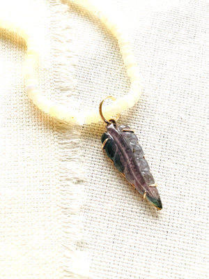 Dainty carved tourmaline leaf prong set in 14kt with a gold bail and strung over Ethiopian opal beads.  This necklace is finished with my signature 14kt gold clasp.  This carved tourmaline necklace reminds me of the beautiful large foliage we have here in Hawaii.