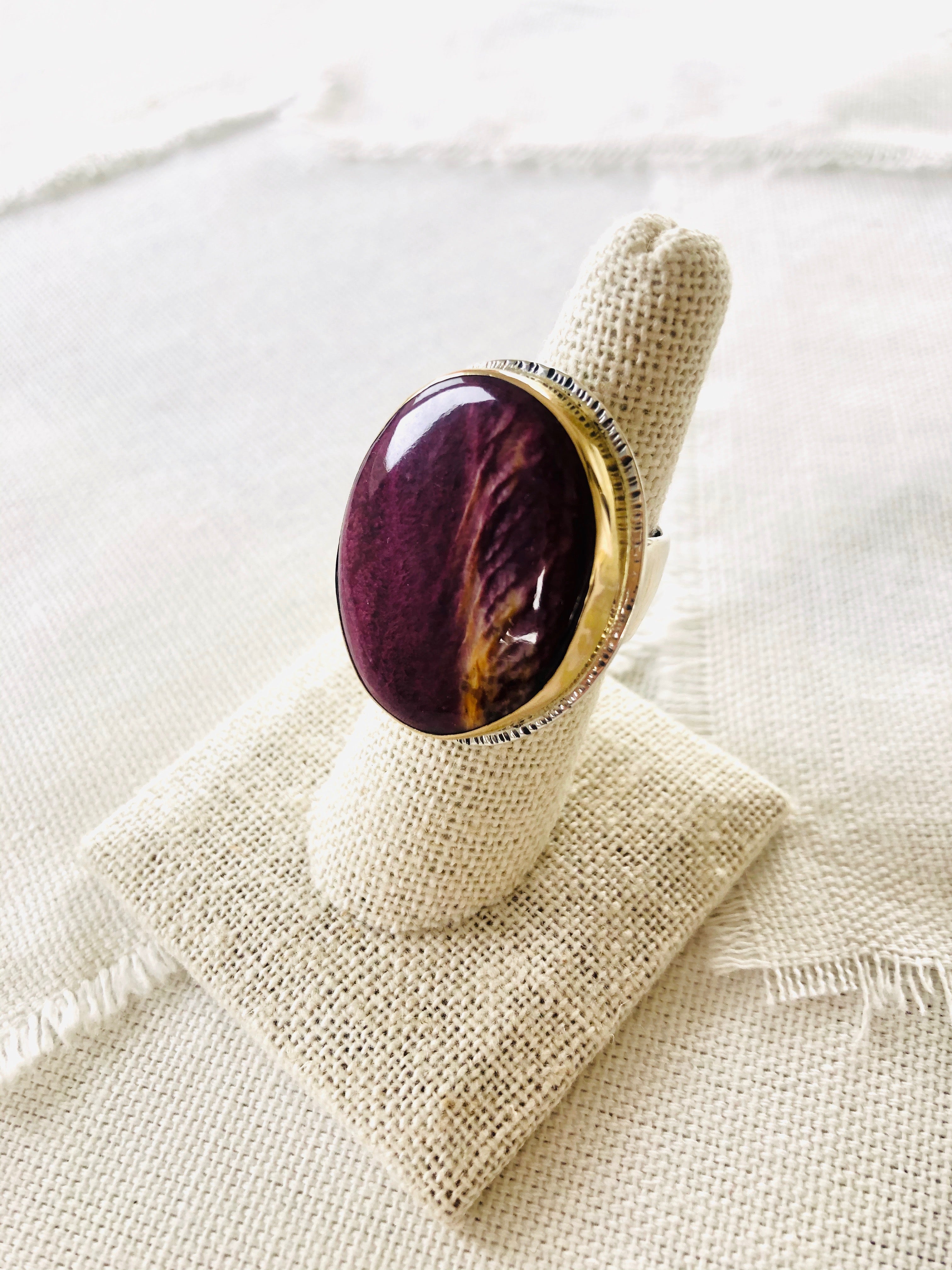 This is a beautiful elegant resort style spiny oyster shell statement ring set with a  14kt gold bezel and sterling silver