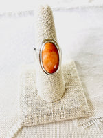 This simplicity of this beautiful orange spiny oyster shell ring makes a statement for itself.